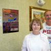 ORV OLM AND MARCI GREEN OF GIZMO GEEZER FAME WITH SPONSOR POSTER