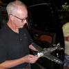 Mike Kelly holding his P-47 while Henry Toews looks on