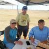 Bob and Tom running numbers on the scoresheets as Rod Persons looks on.