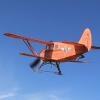 Mike Kelly's Waco C7 on a whiskey delivery run to miners in the frozen arctic. Band across the skiis is either and old fashioned landing hook device or a way to keep the ski tips up. Pilot slurred his words so bad we couldn't tell.