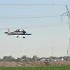 Full-scale home-built airplane flown by Rovey's son off dirt runway