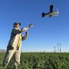 Rich Adams launches his own-design Pilatus Porter floatplane over the cushy Rovey Farms alfalfa - Jonathan Nunez photo