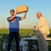 Tom Arnold (R) presents the Walt Mooney Memorial Peanut Scale Trophy to Jonathan Nunez. Jonathan won the Peanut Scale event with a Yak-3 - Mike Kelly photo